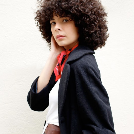 woman with dark curly hairs